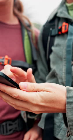 People, hands and hiking with phone for app, navigation system or path finding in outdoor forest. Closeup, hikers or trekking with mobile smartphone for map location, destination or tracking route