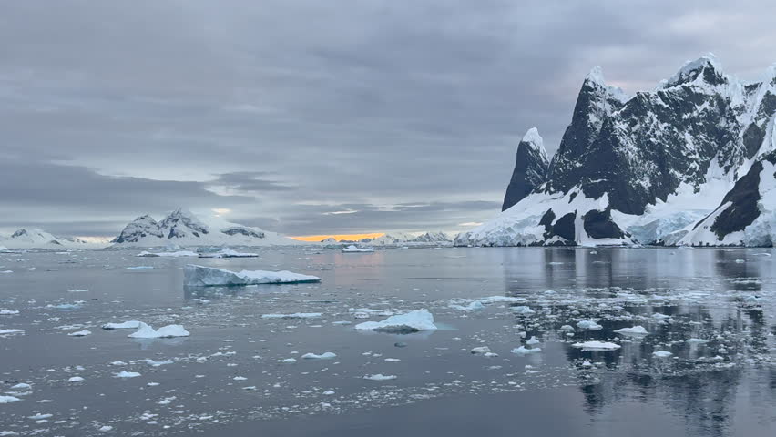 Big Iceberg in Antarctica Winter Scenery, Amazing Shape Ice Formation of Massive Large Enormous Blue Icebergs in Antarctic Peninsula Landscape Seascape with Ocean Sea Water