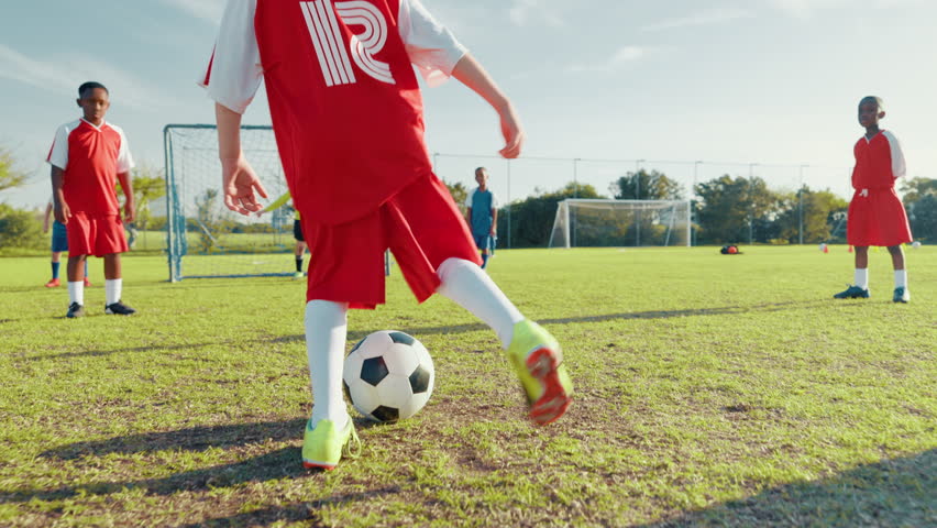 Goal, soccer and running with kids on field for training, sports athlete and fitness. Tournament game, contest and winner with football player on outdoor pitch for club, target and challenge