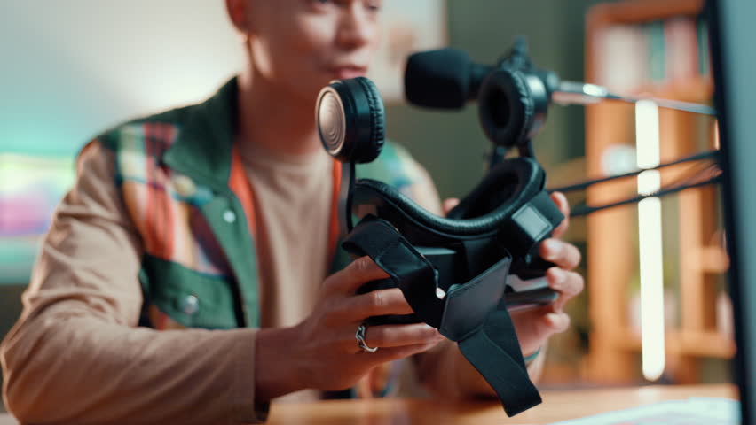 Live streaming, mic and man with vr headset for product review, build quality or show features. Virtual reality goggles, talk and content creator with tech for broadcast or social media promo at home