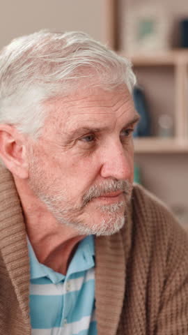 Home, thinking and old man with nostalgia, sad and mental health with retirement. Pensioner, apartment and elderly person with history, depression and alzheimer with memory, thoughts and decision