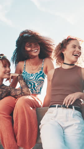 Fashion, friends and happy girls in city to relax for travel, funny conversation and gen z humor. Group, streetwear and style outdoor with women laughing, hang out and chill together on vacation