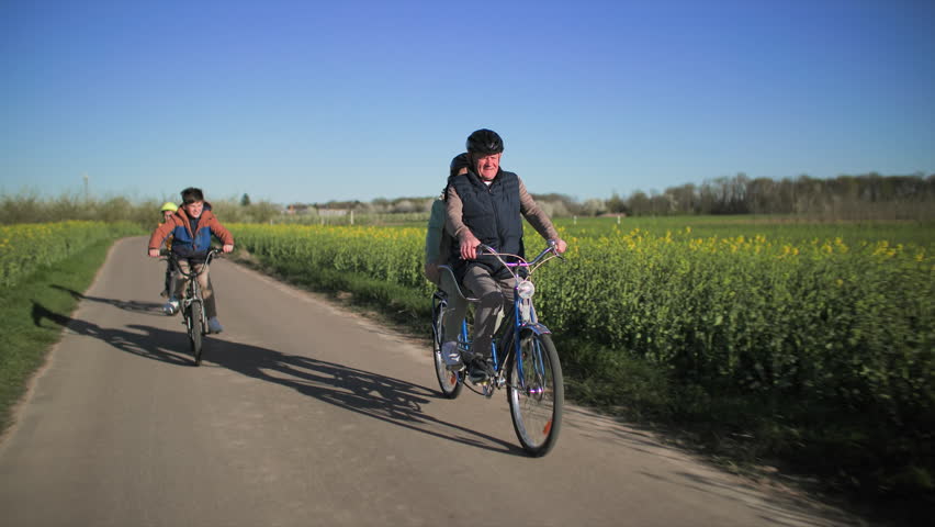 Family bike ride with grandchildren and their grandparents