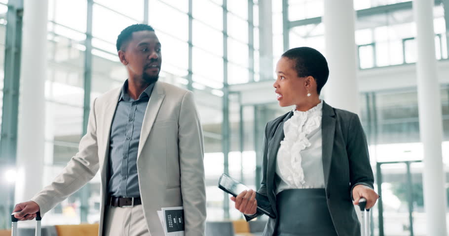 Black people, walking and discussion with luggage for travel, work journey and lawyers in airport. Below, man and woman as attorneys with suitcase for international company, conference and business