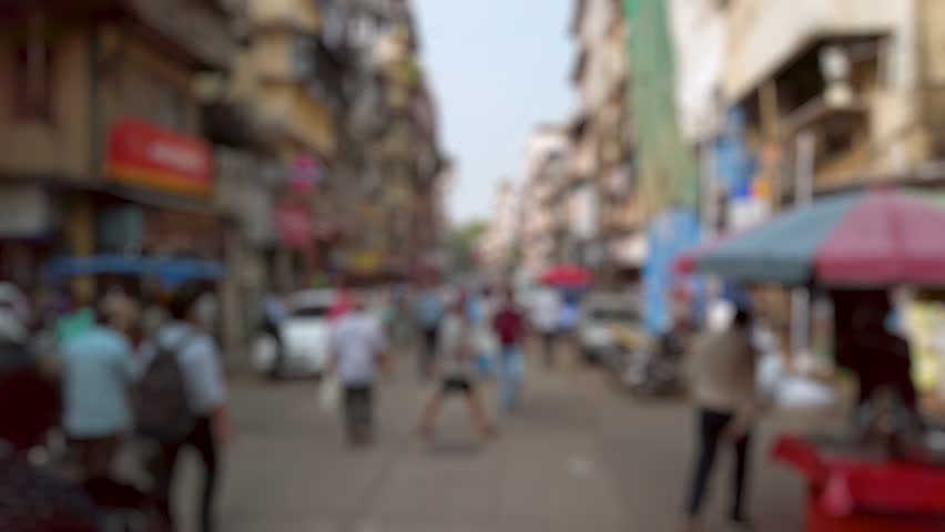 Bokeh view of crowded streets of Mumbai, India. Blurred background footage.