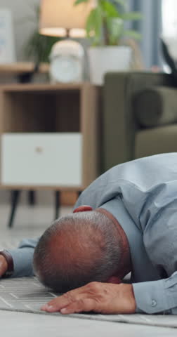 Collapse, emergency and nurse in home with old man, checking pulse and medical support. Healthcare crisis, caregiver and senior person on floor from fall, heart attack or stroke with homecare help