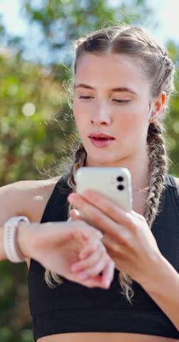 Fitness, woman and phone with smart watch outdoor for data sync, track speed and check results. Athlete, happy and pair smartphone at park for workout progress, performance metrics and exercise pace