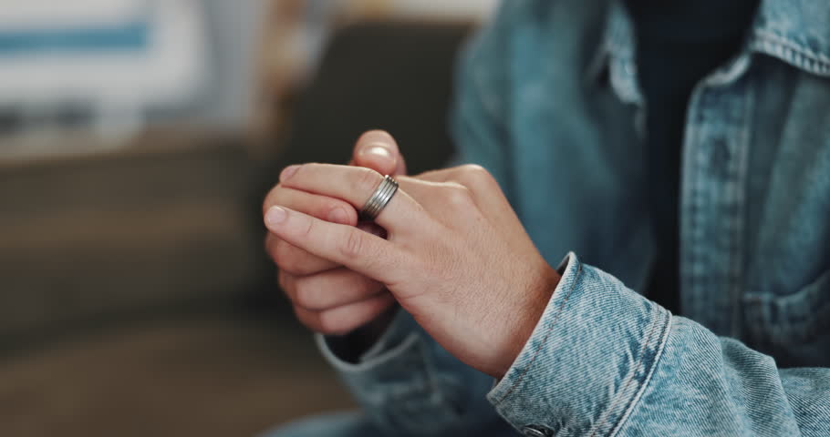 Divorce, hands and man with ring, doubt and toxic marriage with relationship, sad and confused. Closeup, home and person with stress, infidelity and secret affair with jewelry, separation or cheating