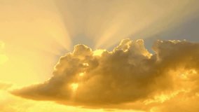Golden Sun Rays Breaking Through Cumulus Clouds at Sunrise - Powered by Shutterstock - Get 15% off with code: PIKWIZARD15