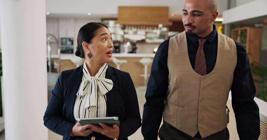 Hotel, tablet or walking with concierge and manager in lobby for booking, reception or reservation. Collaboration, hospitality and schedule with resort staff in lounge for planning or service