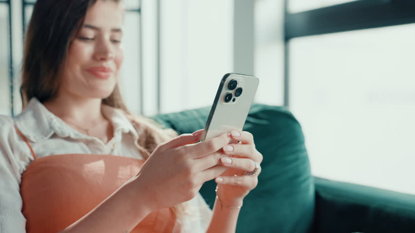 Happy, sofa and woman with phone in home for social media, reading message and chatting. Living room, laugh and person on smartphone for communication, internet and online dating on mobile app