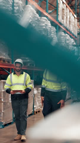 Businessmen, walking or checking stock at warehouse for distribution service or storage control. Male people, contractor or employees with inventory for inspection, supply chain or logistics at depot