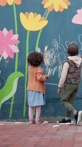 Chalk, drawing and children at preschool for creativity, growth or skill development at mural wall. Education, students and kids outdoor with art for activity, hobby or lesson at kindergarten.