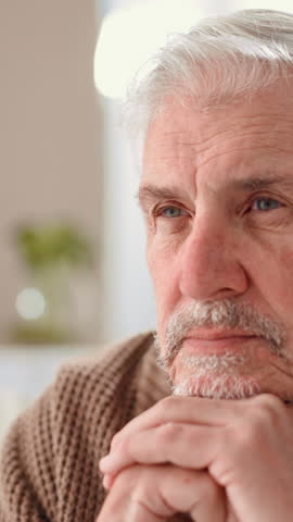 Home, thinking and old man with depression, sad and mental health with dementia. Pensioner, thoughtful and elderly person with history, choice and alzheimer with memory, remember and retirement