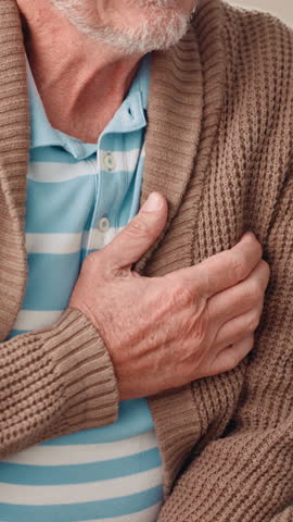 Home, hand or old man with pain, heart attack signs or hypertension with asthma. Closeup, pensioner or senior person with retirement, cardiac symptoms or medical emergency with disease or health risk