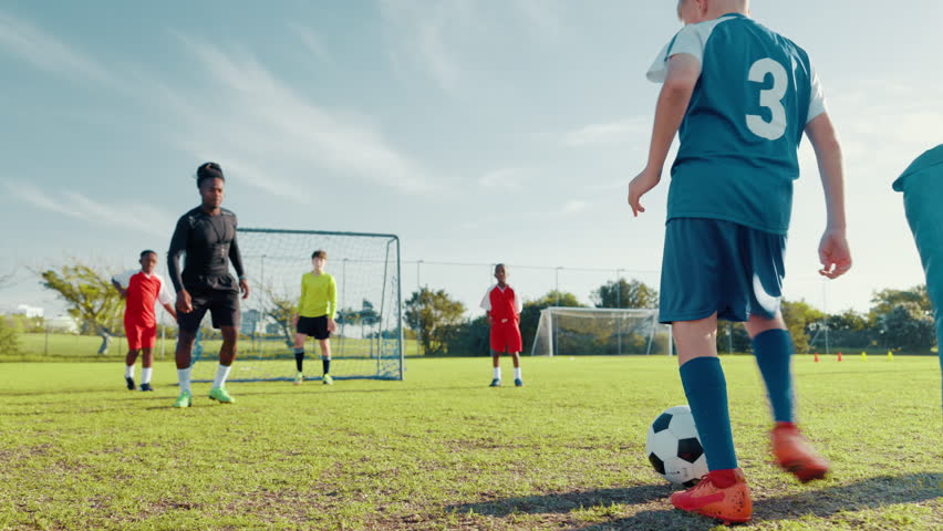 Coach, soccer and goal with kids on field for penalty kick, sports athlete and fitness. Tournament game, shooting and winner with football player on outdoor pitch for club, target and challenge