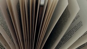 An open book with pages fanned out, creating an intriguing composition. Close-up of an open book showing pages fanning out. The perspective offers a unique, abstract view of the book's interior. - Powered by Shutterstock - Get 15% off with code: PIKWIZARD15