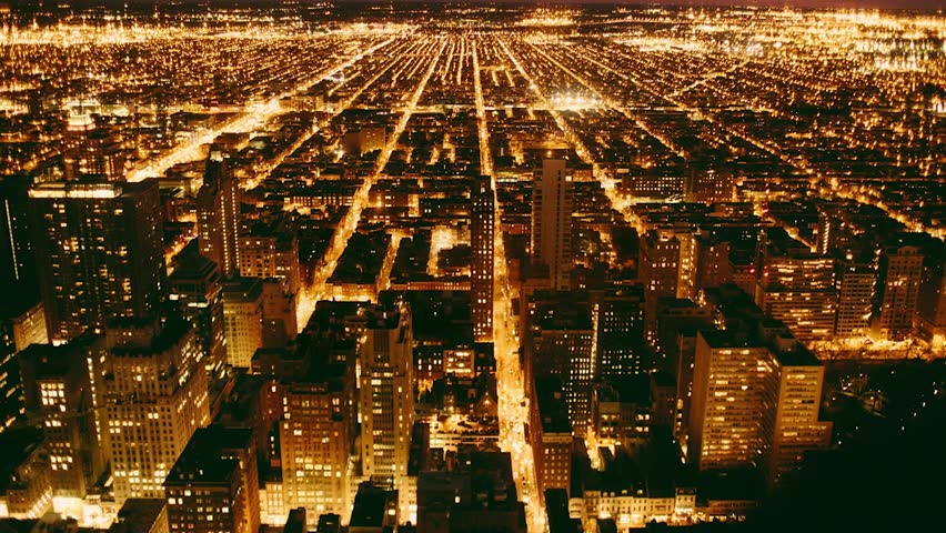 Stunning aerial view of Philadelphia at night in Pennsylvania, USA, featuring illuminated skyscrapers, city lights, and urban architecture under a dark sky.