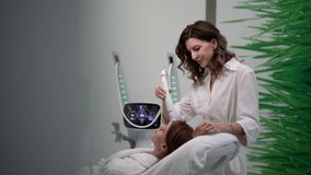 Beautician performing mesotherapy treatment, targeting facial skin rejuvenation with specialized dermatological equipment to female client in modern aesthetic clinic. Shooting in slow motion. - Powered by Shutterstock - Get 15% off with code: PIKWIZARD15