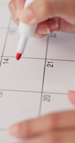 Person, hands and calendar with heart for valentines day, schedule or planning romantic date. Reminder, marker or love with agenda or event for month of romance, commitment or booking reservation