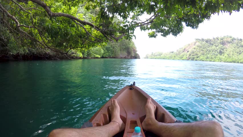 Canoeing in the Papuan fjords in Papua New Guinea. High quality 4k footage