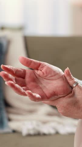 Hands, senior woman and wrist pain in home with arthritis, inflammation and carpal tunnel syndrome. Pensioner, elderly person and massage joint with osteoporosis, fibromyalgia risk and muscle tension
