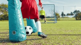 Child, dribble and ball for soccer practice with inflatable, team training and fitness exercise. Children, equipment and defence drill of sports workout, skill technique and agility of cardio routine - Powered by Shutterstock - Get 15% off with code: PIKWIZARD15