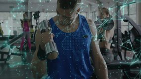 Mid-adult man performing bicep curls at gym starting network overlay tracking fitness metrics. Fitness, strength, technology, wellness, determination, training, modern - Powered by Shutterstock - Get 15% off with code: PIKWIZARD15