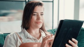 Home, girl or scroll with tablet on sofa for online shopping, streaming subscription or app review. Relax, woman or digital tech for internet research, reading ebook or social media update on weekend - Powered by Shutterstock - Get 15% off with code: PIKWIZARD15