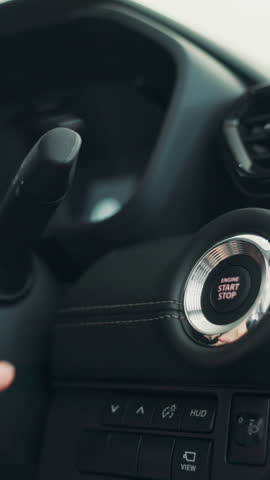 Hand, push button and start car for travel, journey and self driving with keyless technology. Electric ignition, person or press switch for engine power, transport or autonomous motor vehicle closeup