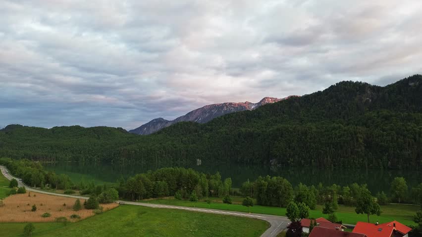 Landscape Drone Footage of Weißensee in Bavaria, Germany, lake, mountain and forest in the background