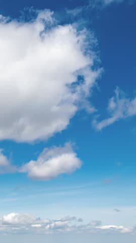 White Clouds Moving in Blue Sky Background Vertical Time Lapse
