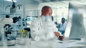 Lab, analysis and man with computer, plants and medical research for disease resistance and science. Experiment, biologist and mature person with tech for breakthrough, online and sustainability - Powered by Shutterstock - Get 15% off with code: PIKWIZARD15