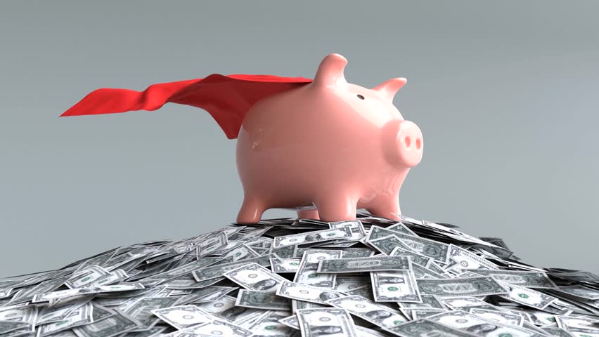 A piggy bank covered in a red cloth stands on a pile of banknotes