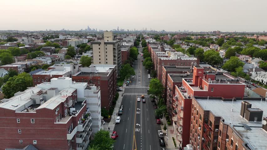 Top-down drone view of Brooklyn’s residential landscape, filled with mid-rise buildings, homes, and organized streets stretching across a vibrant and historic urban district