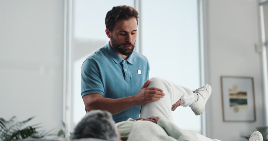 Injury, knee or stretching with patient and physiotherapist in office for assessment. Health, medical or rehabilitation with chiropractor and man in session for accident, emergency or recovery