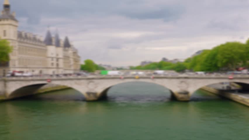 View of the bridge Pont au Change over the Seine River, island Ile de la Cit and the Conciergerie in 1st arrondissement, Paris, France. Out of focus.