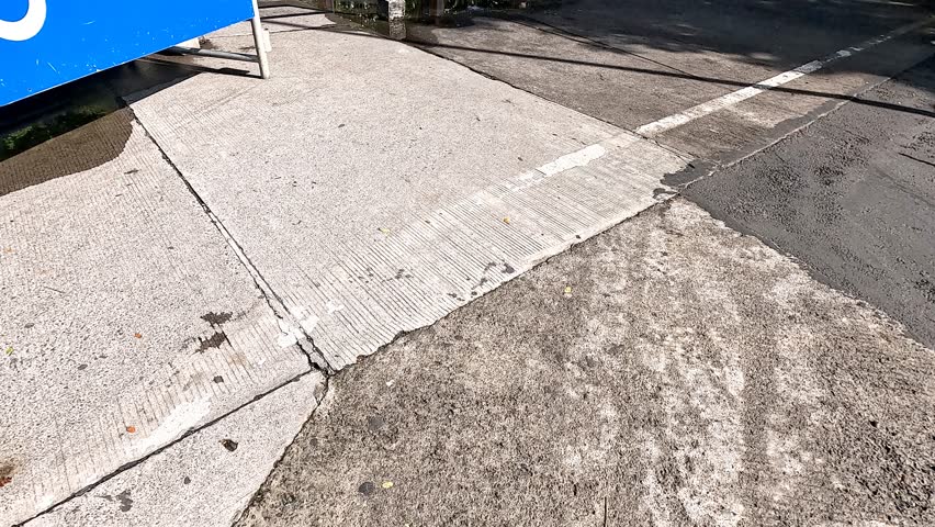 Cinematic high quality 4K footage of big blue board direction to motorbike parking building with phrase Parkir Gedung