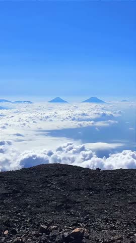 beautiful view of the peak of mount kerinci with clouds moving