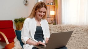 Woman reacts with surprise to unexpected good news, celebrate win victory on laptop at home, eyes widened. Happy adult girl shows joyful amazement, emotionally uplifted by pleasant online discovery. - Powered by Shutterstock - Get 15% off with code: PIKWIZARD15