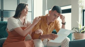 Couple, document and stress in home for debt, payment notice or declined loan with worry in lounge. Invoice letter, paperwork and man with woman in house with mortgage problem, crisis or eviction - Powered by Shutterstock - Get 15% off with code: PIKWIZARD15