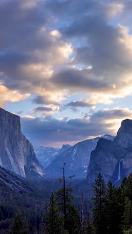 Time Lapse of the the clouds moving over the amazing landscape of Yosemite National Park in California. Vertical Video.