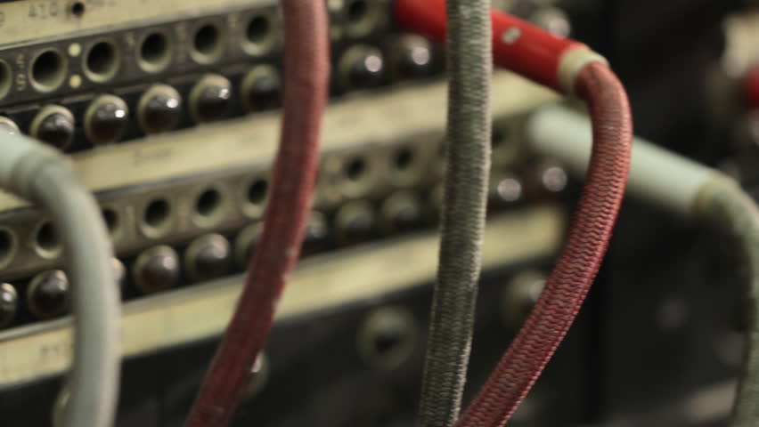 Quick move to reveal cables and details of an old telephone switchboard.