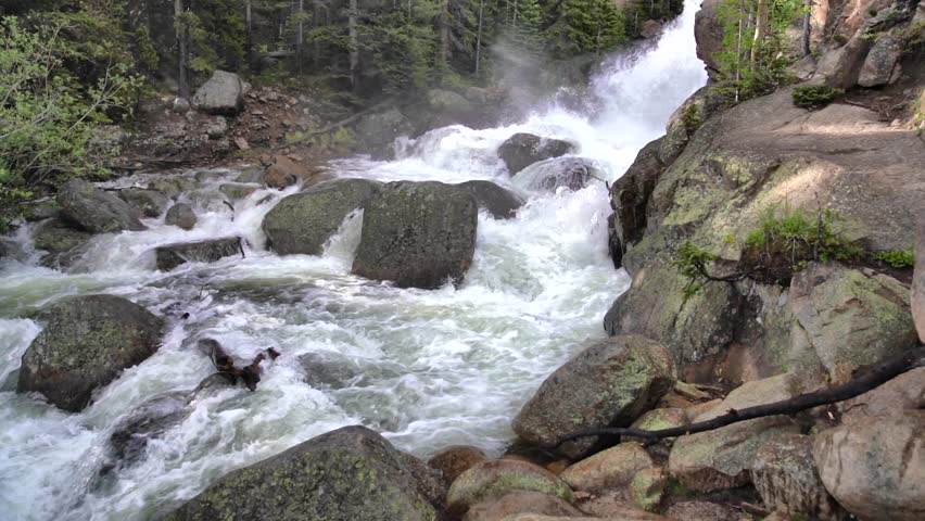 Slow Motion Torrent of water rushing down a mountain stream during late spring thaw