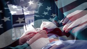 American flag overlay starting surgery as female surgeon cutting tissue and stitching wound. Medical, healthcare, operative, innovation, teamwork, professionalism, hospital - Powered by Shutterstock - Get 15% off with code: PIKWIZARD15