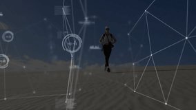 Woman hiker descending dune initiating technology HUD overlay with network charts tracking movement. Adventure, exploration, data visualization, wearable tech, outdoor activity, futuristic, navigation - Powered by Shutterstock - Get 15% off with code: PIKWIZARD15