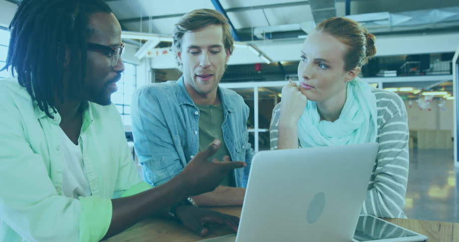 coworker typing at keys starting lock growing around laptop as team leaning in discussing security. Collaboration, teamwork, innovation, technology, digital, communication, modern