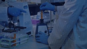 Laboratory technician lifting test tube into mixer and turning knob for mixing with rotating dial. Science, innovation, precision, experimentation, digital, technology, teamwork - Powered by Shutterstock - Get 15% off with code: PIKWIZARD15