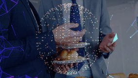 Two business colleagues holding trays conversing at hall initiating network displaying device icons. Corporate, networking, data visualization, technology, communication, modern, professional - Powered by Shutterstock - Get 15% off with code: PIKWIZARD15