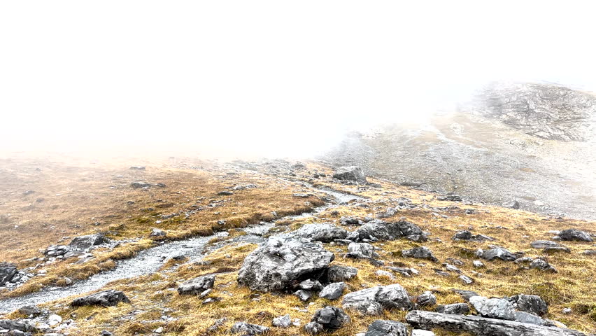 Panning Over Foggy Trail on Countryside in Swiss Mountains